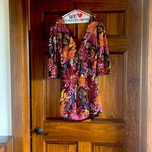 Short mini dress from free people! Beautiful flower design with sequins.
